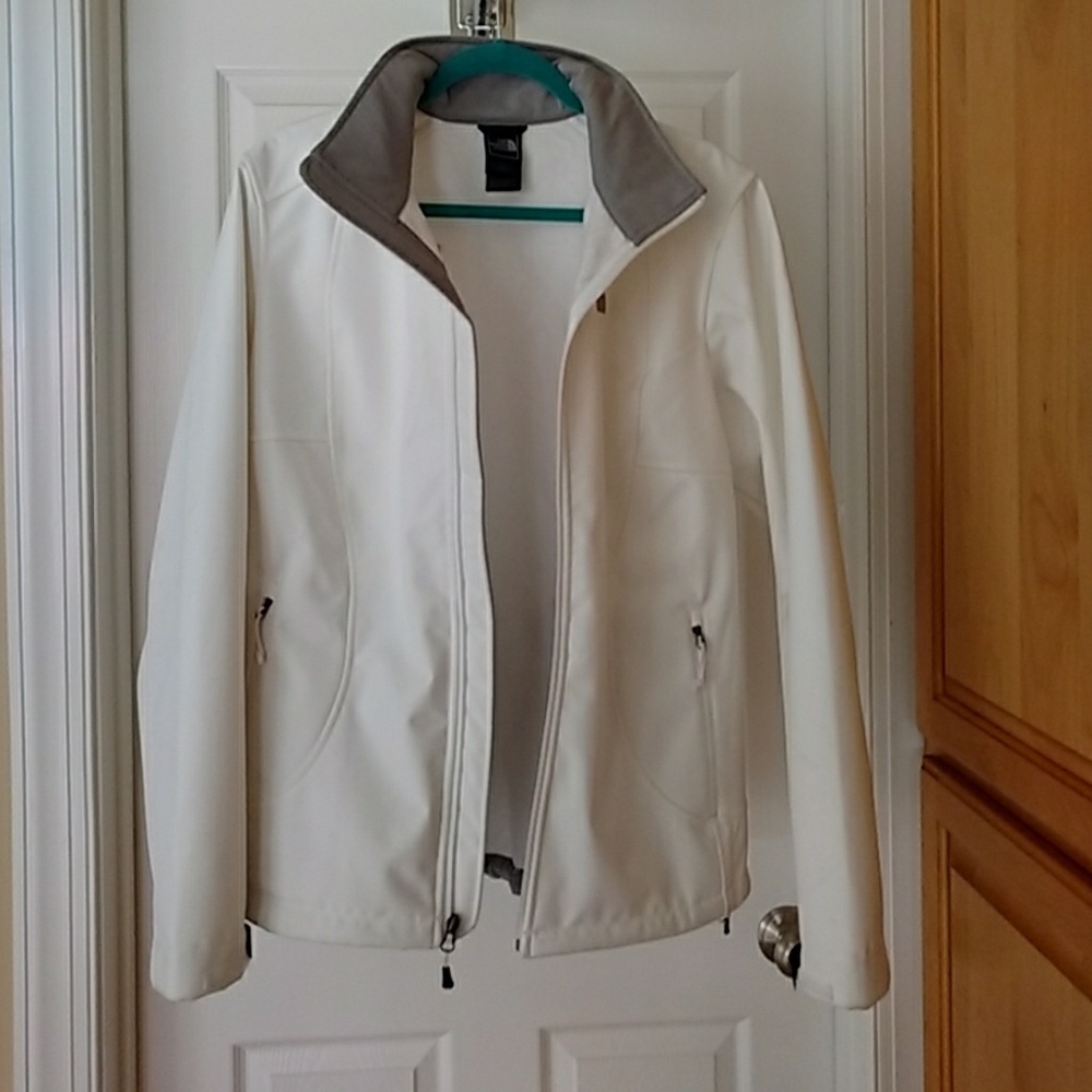 White north face jacket with grey trim at collar.